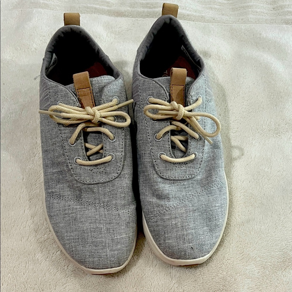 Women’s size 9.  Light gray casual Tom’s sneakers. Worn one time.